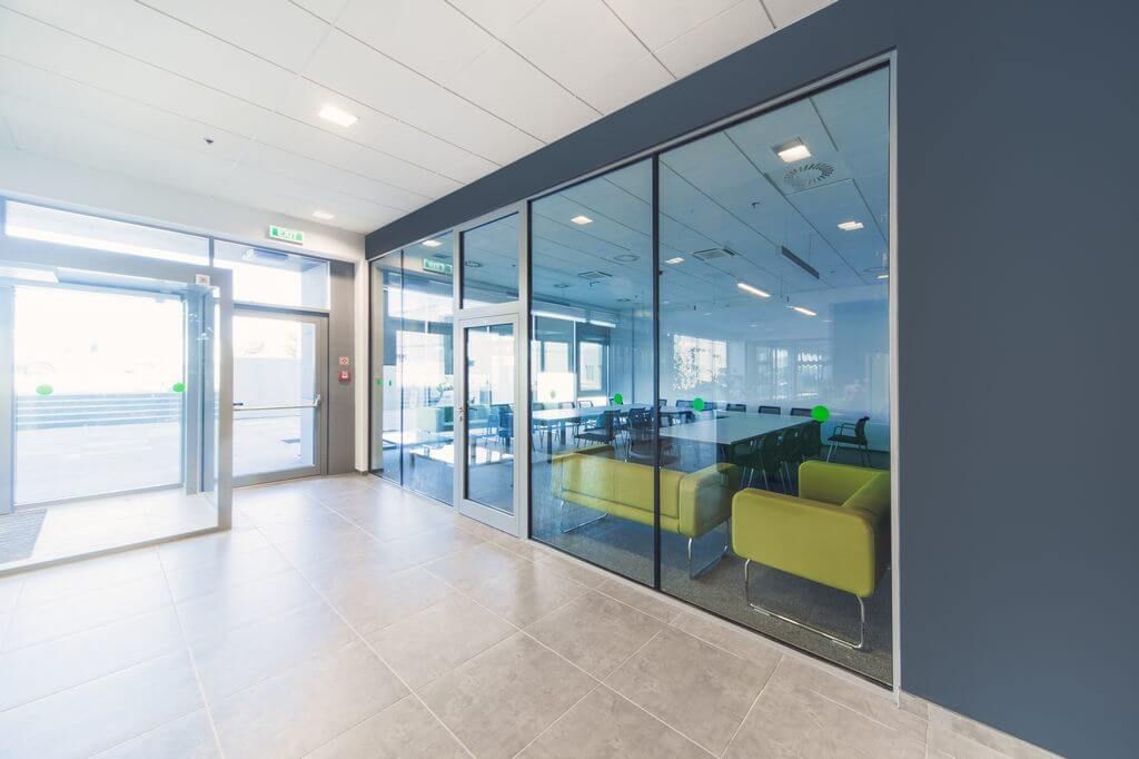 Fire-rated roller shutter in a commercial opening