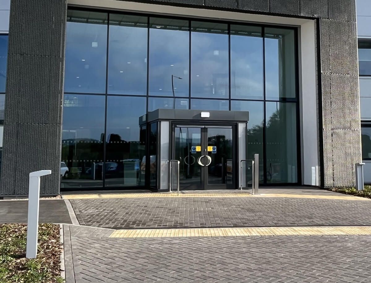 Full-height curtain walling framing an automatic entrance at a commercial office