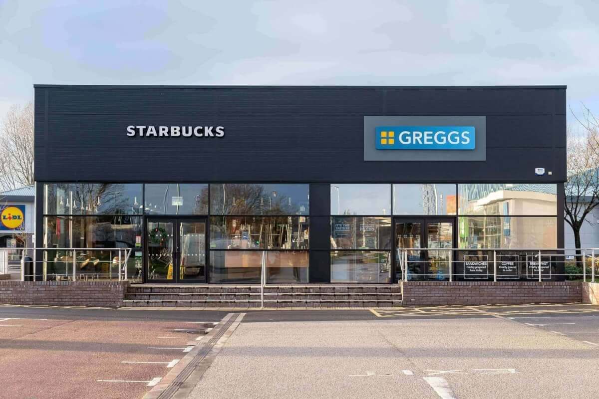 Dark aluminium shopfront glazing for a Starbucks and Greggs retail-park unit