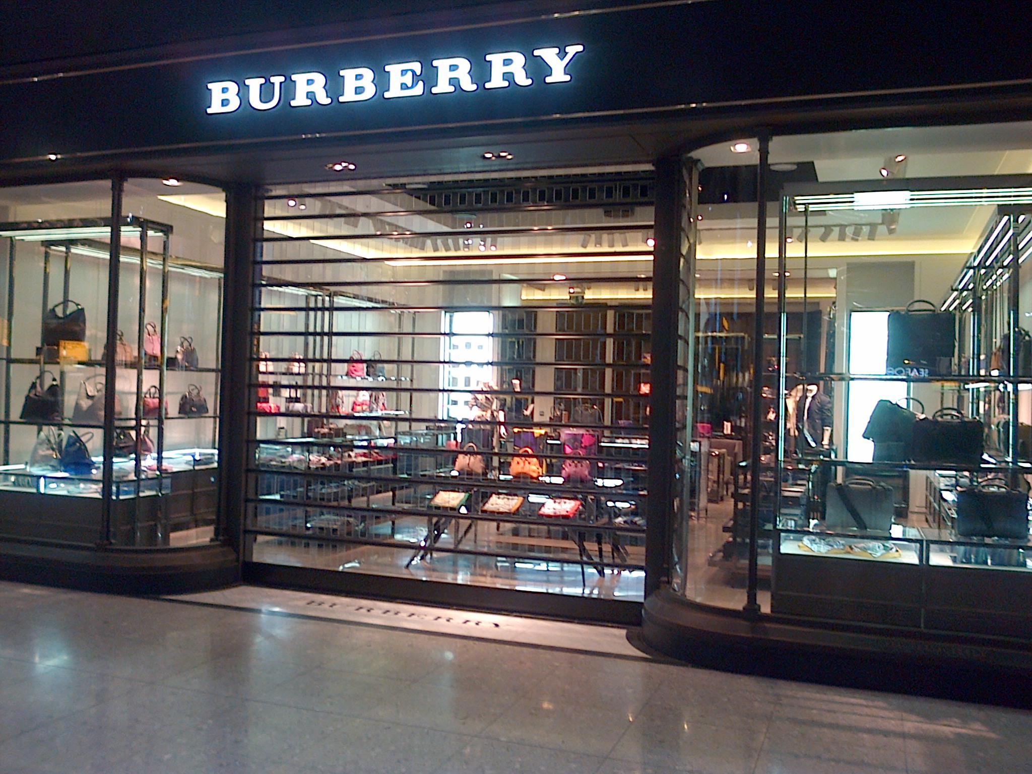 Polycarbonate roller shutter keeping a Burberry window display visible